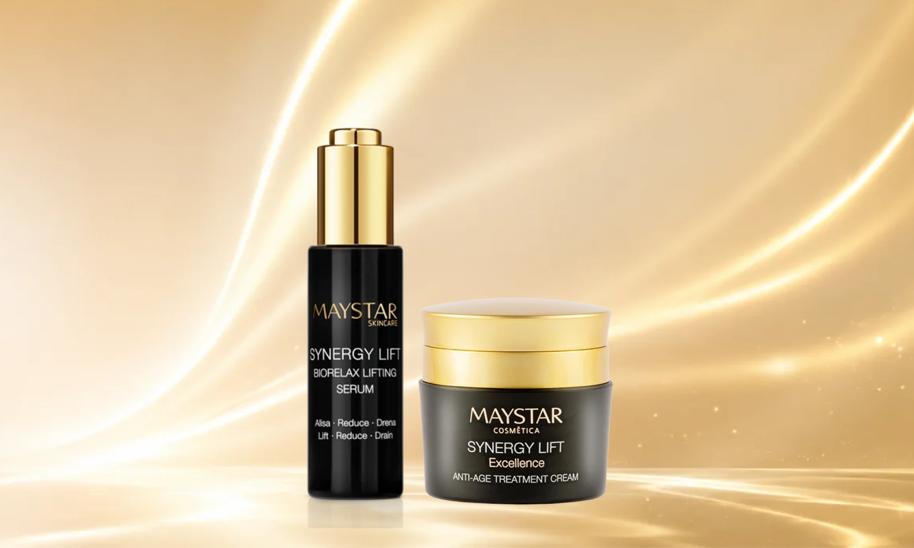 Zwei Kosmetikprodukte von Maystar Synergy Lift, ein schwarzer Serumflakon mit goldfarbenem Verschluss und ein goldfarbener Cremetiegel auf goldfarbenem Hintergrund